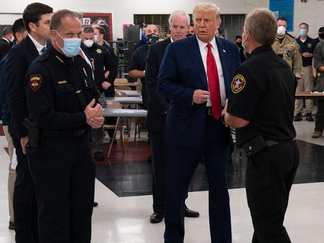 Donald Trump with police officers in Kenosha. Picture: AP.