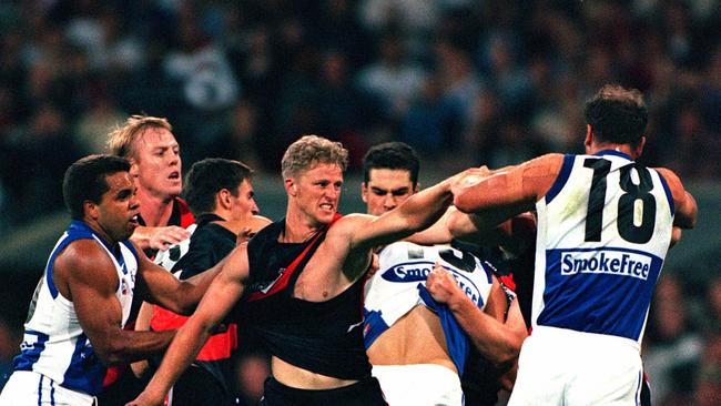 Damien Hardwick takes on Wayne Carey in 2000.