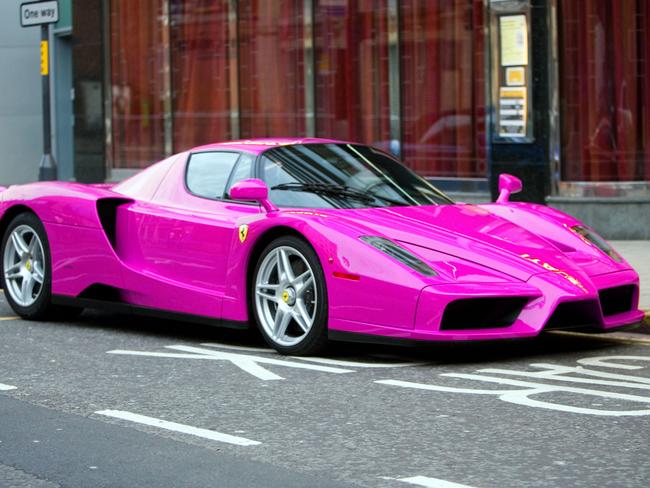 ONLINE ONLY AD4JP2 Pink Ferrari enzo parked outside restaurant in Leeds. Picture: Alamy