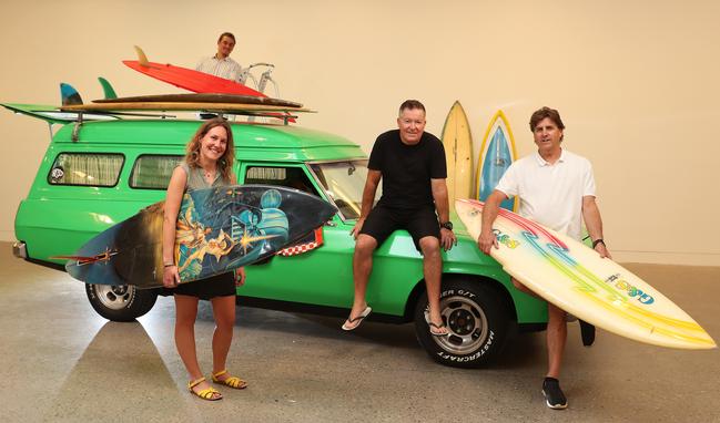 Jeff Killick (centre) whose restored panel van is bound to be a major talking point of Southern Swell, an exhibition of surfing memorabilia, photography and art at Hazelhurst Arts Centre in Gymea. Left to right with Killick are artist Nicole Kelly, filmmaker Cameron Staunton and exhibition co-curator and photographer John Veage. Picture: Brett Costello