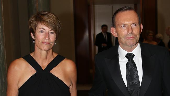 Job ID PD301884. The Prime Minister Tony Abbott with his wife Margie, wearing a Simona black evening dress, arrive for the Mid Winter Ball. Pic by Gary Ramage