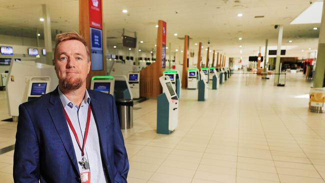 Queensland Airport Limited CEO Chris Mills in an empty Gold Coast Airport check in area. Photo Scott Powick Newscorp