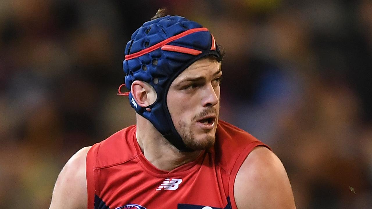 Angus Brayshaw of the Demons (left) and Bachar Houli of the Tigers contest the Round 20 AFL match between the Melbourne Demons and the Richmond Tigers at the MCG in Melbourne, Saturday, August 3, 2019.  (AAP Image/Julian Smith) NO ARCHIVING, EDITORIAL USE ONLY