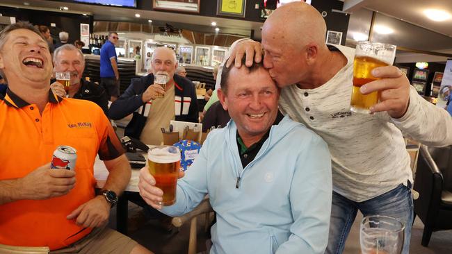 Cameron Smith’s father Des Smith celebrating his son winning the British Open with friends at the Wantima Golf Club, Brendale. Picture: Liam Kidston