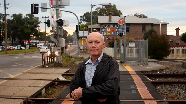 Riverstone Schofields Chamber of Commerce president Kurt Hippe at the Riverstone railway crossing. Picture: Peter Kelly