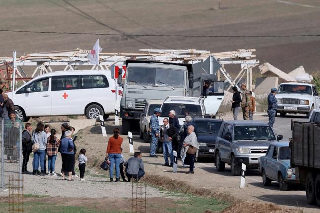 Refugees waited to be registered near the border town of Kornidzor