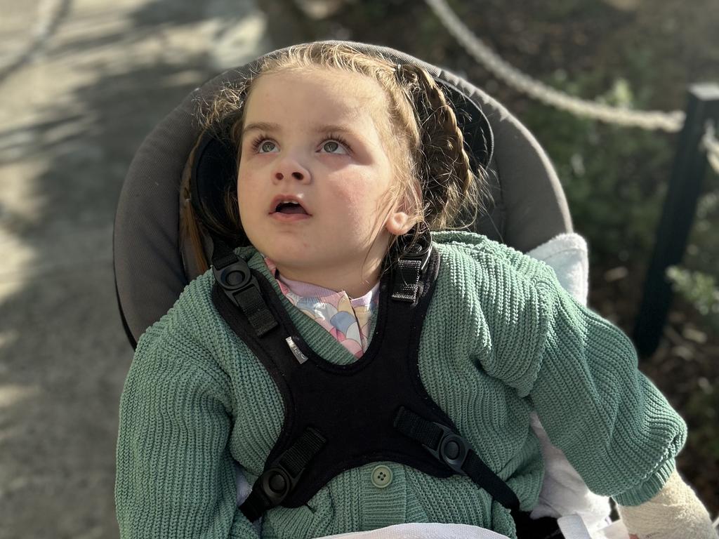 Koa Gibson, 3, has multiple illnesses and disabilities which impact her breathing, movement and brain. Her family is mum Aleisha, dad Ben, big sister Ava, 6, and little sister Sky, 10 months. The family lives in Armstrong Creek