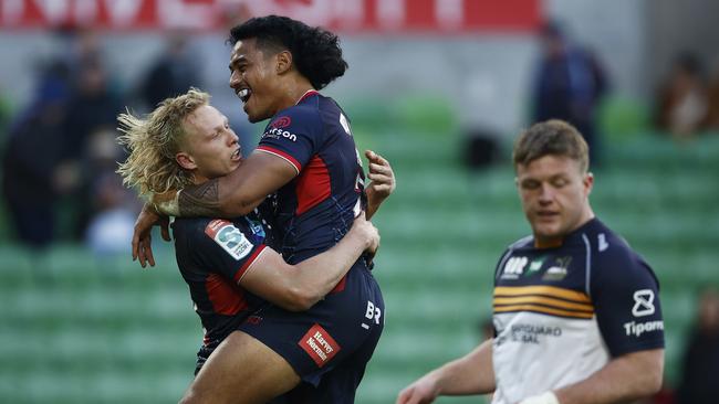 Carter Gordon of the Rebels, left, celebrates scoring a try against the ACT Brumbies at AAMI Park. Picture: Getty Images