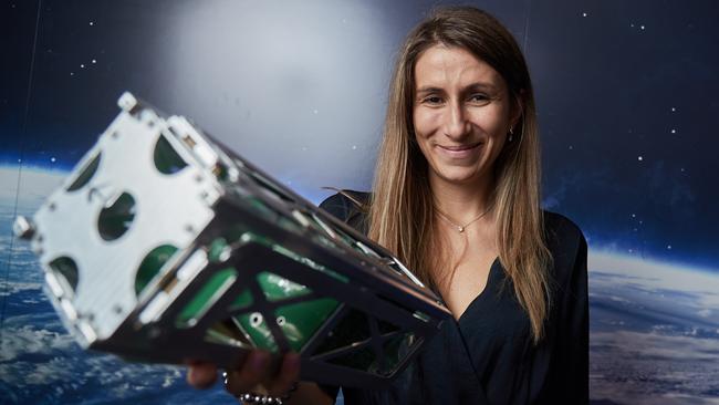 Flavia Tata Nardini from Fleet Space with a nano satellite prototype last year. Picture: AAP / Matt Loxton