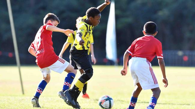 SOCCER: Junior football carnival, Maroochydore. Gold Coast Knights (red) V Moreton Bay United, boys. Picture: Patrick Woods.