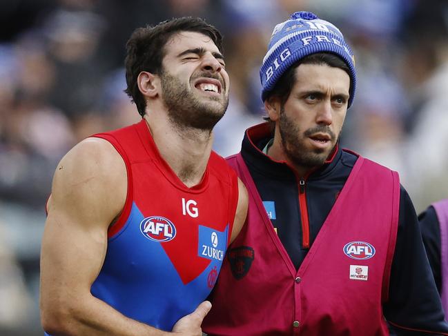 MELBOURNE, AUSTRALIAÃ June 10, 2024.  AFL Round 13. Big Freeze at the G. Collingwood vs Melbourne  at the MCG.   Christian Petracca of the Demons in pain after copping a Darcy Moore knee in the ribs late in the 1st qtr.       . Pic: Michael Klein