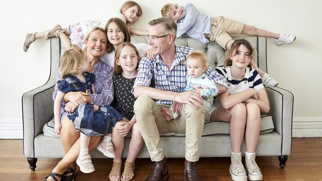 Perrottet and wife Helen at home with their seven children. Picture: Katie Kaars