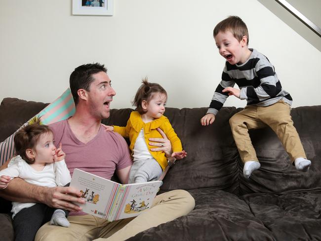 NAB analyst engineer Leif Pedersen at home with twins Margot and Frankie, 18 months, and son Will, 3. Picture: Ian Currie