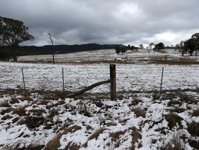 CMNEWS_Snow covered land in Ballandean on the NSW Queensland  border today Friday July 17th, 2015. Pictures: Jack Tran / The Courier Mail