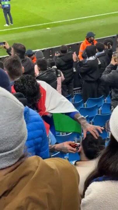 Fan Gets a Haircut During Man City v Real Madrid Match