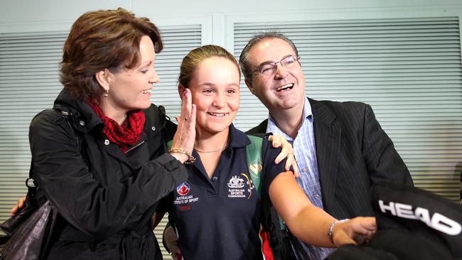 Josie and Robert Barty with Ash, 15, after she arrived home from her Wimbledon victory. Picture: Tim Marsden