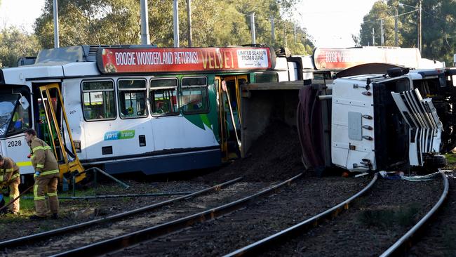 The truck came to rest on the tram tracks and derailed the tram. Picture: Nicole Garmston
