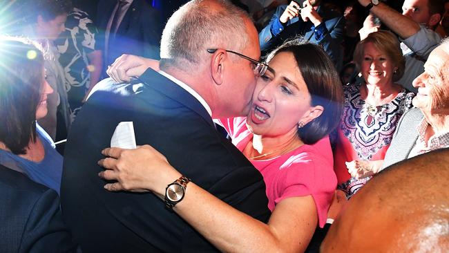 Gladiator.... Gladys Berejiklian celebrates with Scott Morrison on Saturday night. Picture:AAP