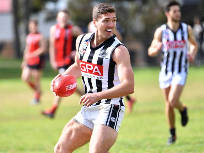 Adelaide Football League division one preliminary final: Rostrevor Old Collegians (red) vs Payneham Norwood Union (white) played at Magill, Adelaide on Saturday the 15th of September 2018. Liam Davis (Pay)(AAP/ Keryn Stevens)