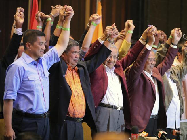 Mahathir Mohamad, third left, celebrates at a hotel in Kuala Lumpur. Picture: AP