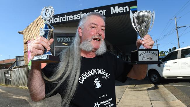 Paul Gee with his Mulletfest trophies outside The Head Shed in Heathmont. Picture: Josie Hayden