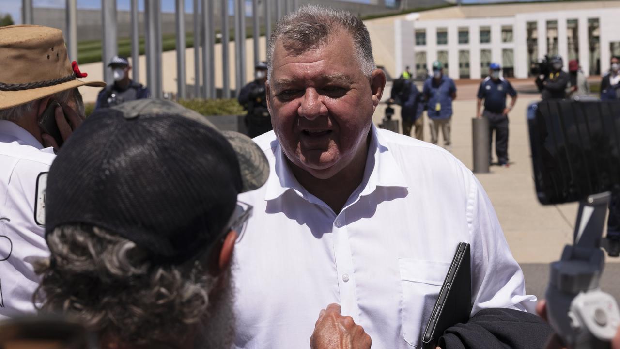 Craig Kelly meeting a protester. Picture: Brook Mitchell/Getty Images