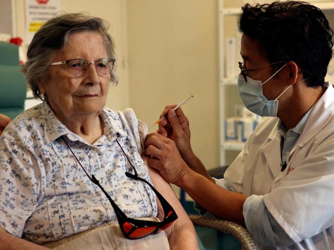 An elderly patient receives the third dose of the Pfizer-BioNtech Covid-19 vaccine in Paris, on 13 September. Picture: AFP