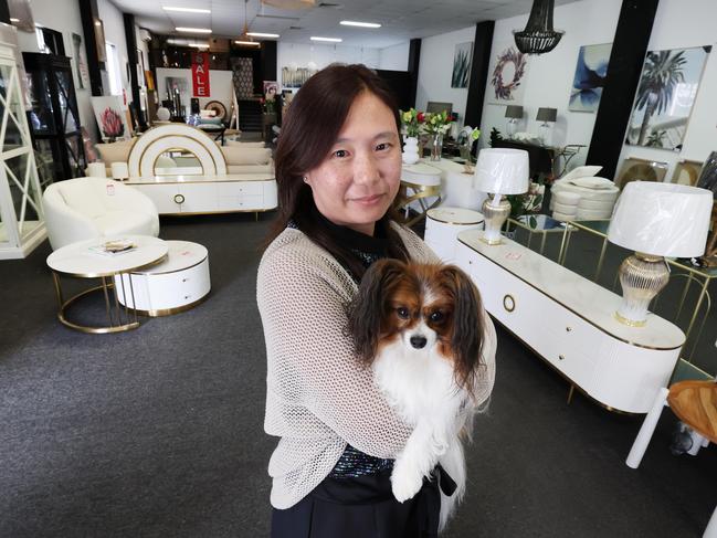 Found on Ferry is closing down after 12 years due to cash flow crisis. Owner Winnie Chin and her dog Lolly inside the store for one last sale where everything must go. Picture Glenn Hampson