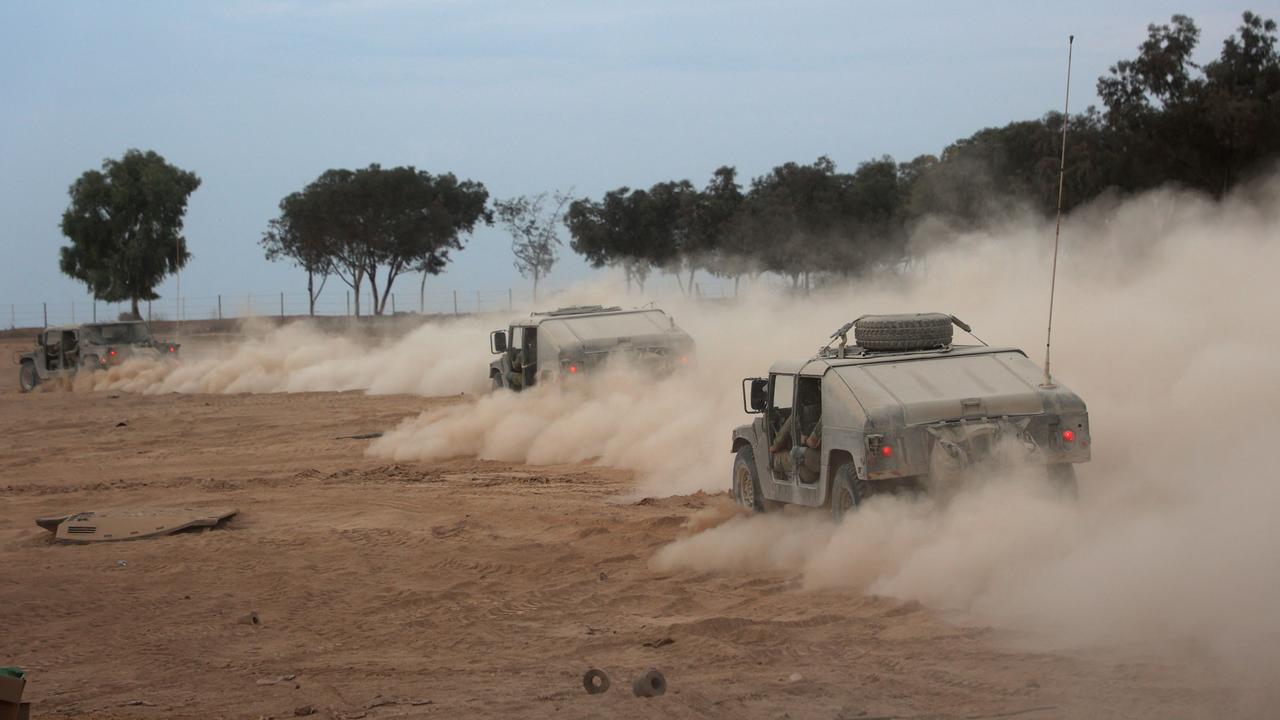 Israeli military vehicles drive towards the Gaza Strip. Picture: AFP