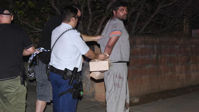 Police arrest Shahab Ahmed after he stabbed his wife to death. Picture: Gordon McComiskie