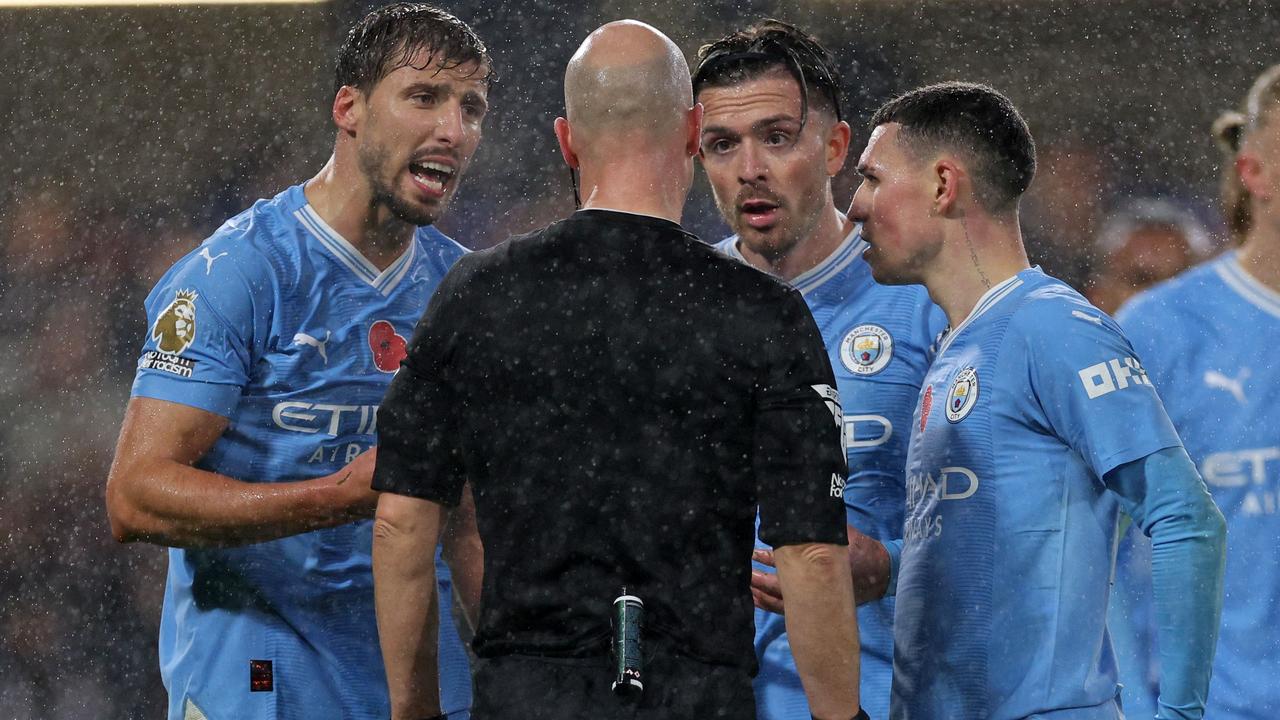 Manchester City desperately tried to plead their case after giving away a last-minute penalty. (Photo by Adrian DENNIS / AFP)