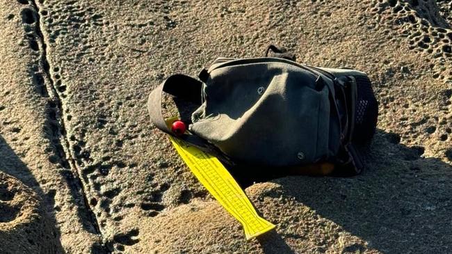 An air and sea search was launched after fishing gear was found on rocks adjacent to Dudley Beach on July 11, 2024. Picture: NSW Police.