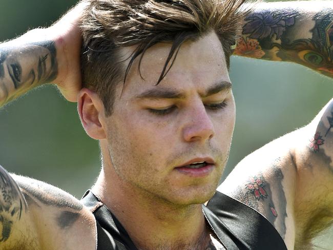 Jamie Elliott at the end of a tough training session in the heat late this morning Collingwood younger players are back on the training track. Picture : Mike Keating.