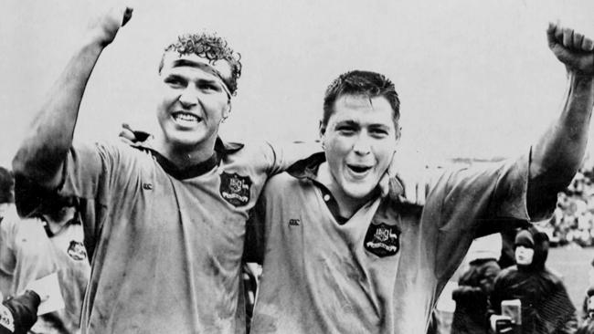 Sam Scott-Young (left) and Phil Kearns celebrate after the Wallabies’ win over New Zealand at Athletic Park in Wellington in 1990.