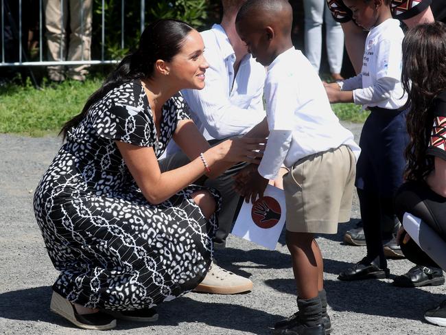 Meghan, Duchess of Sussex meets a young boy as they visit a Justice Desk initiative in Nyanga township. Picture: Chris Jackson/Getty Images.