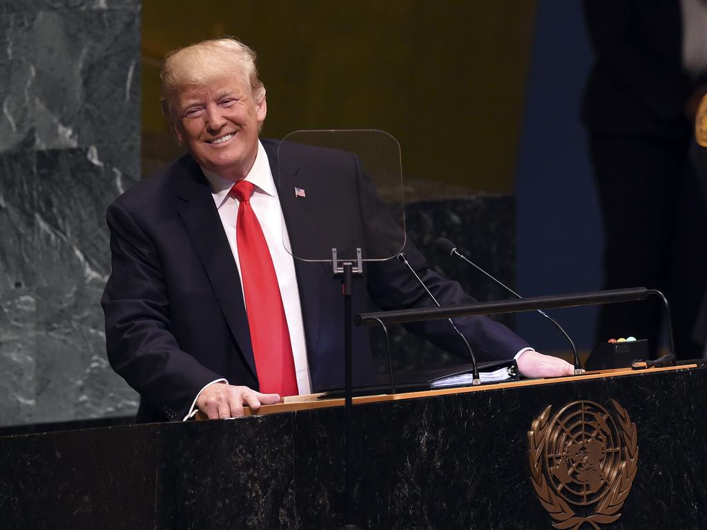 US President Donald Trump smiled after the audience laughed at him. Picture: AFP