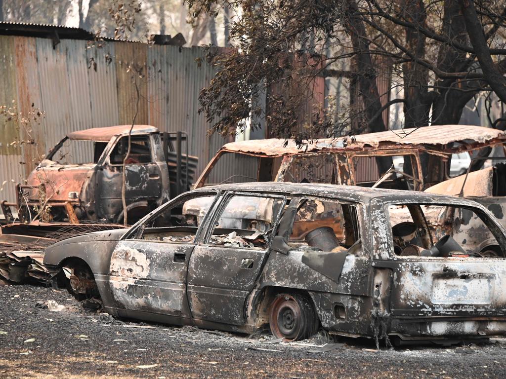 The burnt-out remains of cars and property at Old Bar. Picture: Peter Parks/AFP