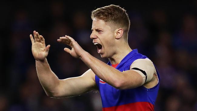 MELBOURNE, AUSTRALIA - JULY 28: Lachie Hunter of the Bulldogs celebrates a goal during the round 19 AFL match between the Western Bulldogs and the Fremantle Dockers at Marvel Stadium on July 28, 2019 in Melbourne, Australia. (Photo by Matt King/Getty Images)