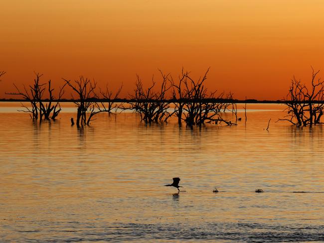 DAILY TELEGRAPH AUGUST 9, 2022.  EMBARGOED FOR BUSH SUMMIT AUGUST 26TH 2022. PLEASE CONTACT PIC EDITOR NICOLA AMOROS BEFORE PUBLISHING.Sunset over Menindee Lakes in far west NSW. Picture: Jonathan Ng