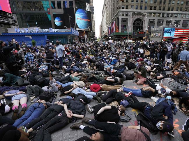 Protesters lay on the ground with their hands behind their back in a call for justice for George Floyd in Times Square, New York. Picture: AFP