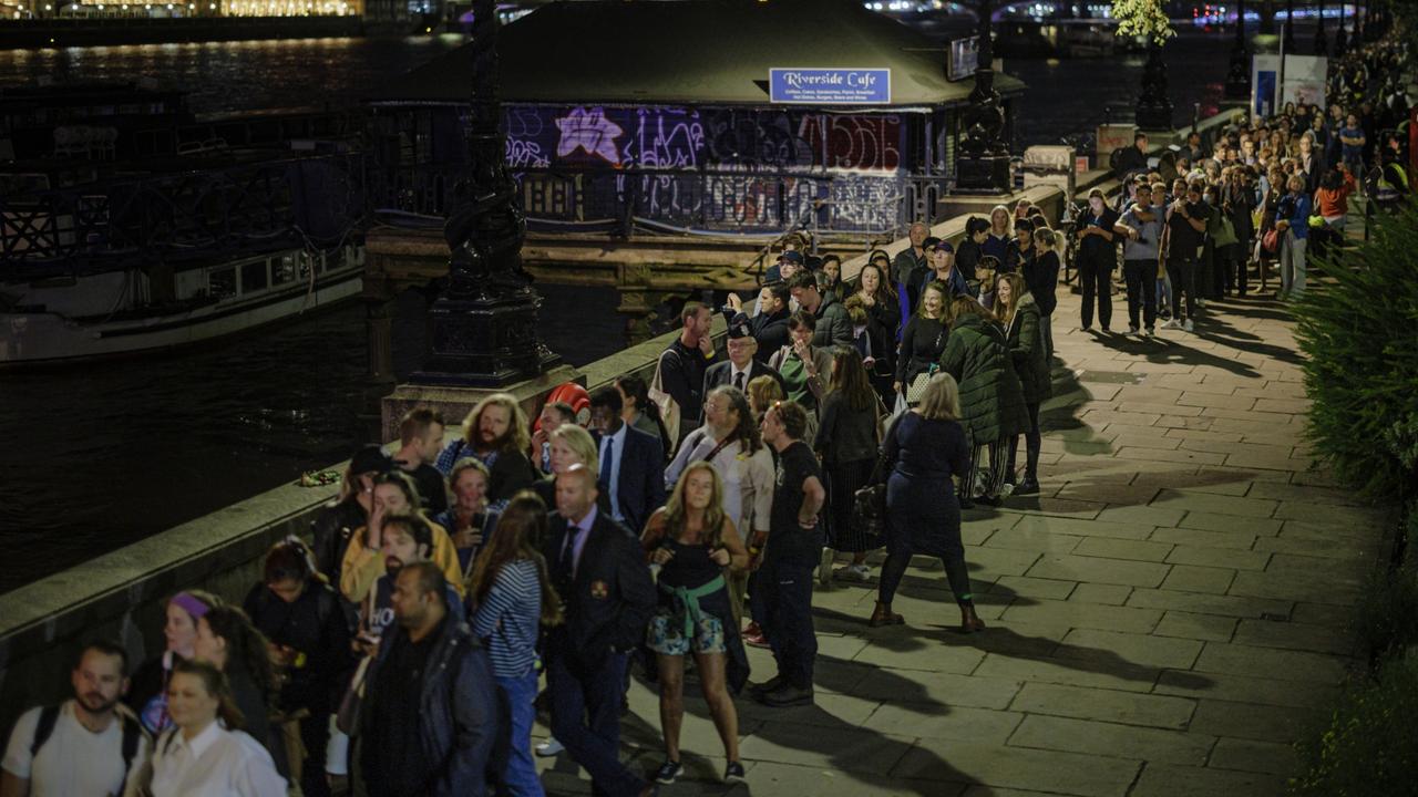 People queue along the Thames Embankment as tens of thousands of people join queues to see Queen Elizabeth II lying in state at Westminster Hall. Picture: Rob Pinney/Getty Images