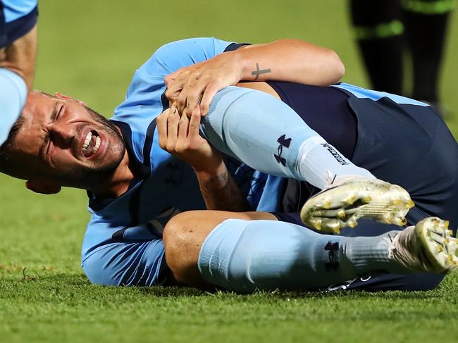 SYDNEY, AUSTRALIA - FEBRUARY 08: Chris Zuvela of Sydney FC holds his knee as he lies injured on the ground during the A-League match between Sydney FC and the Wellington Phoenix at Netstrata Jubilee Stadium, on February 08, 2021, in Sydney, Australia. (Photo by Mark Kolbe/Getty Images)