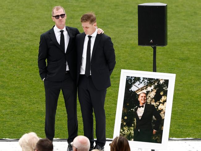 Adam and Scott Selwood embrace during Troy Selwood's funeral in February. Picture: Getty