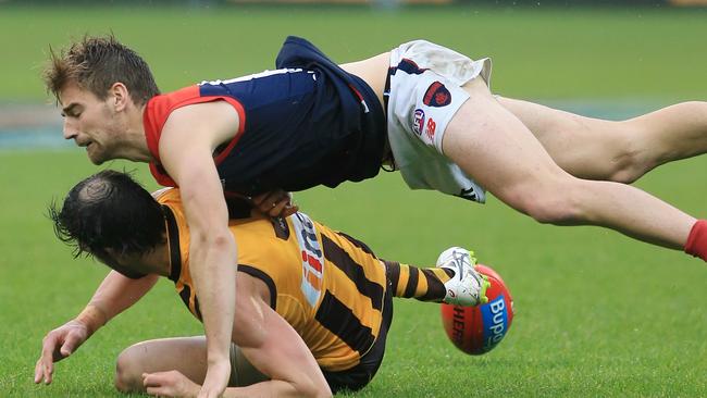 Dom Tyson falls into the back of Jordan Lewis. Picture: Wayne Ludbey