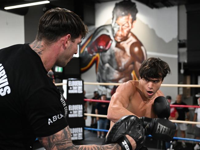 Curtis Scott holding pads for Brock Jarvis. Picture: No Limit Boxing