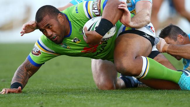 Junior Paulo of the Raiders is tackled.