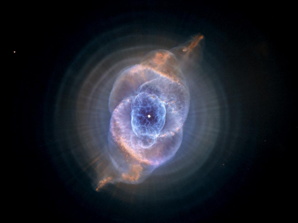 The Cat’s Eye Nebula, one of the first planetary nebulae discovered, also has one of the most complex forms known to this kind of nebula. Eleven rings, or shells, of gas make up the Cat’s Eye. Each ring is actually the edge of a spherical bubble seen projected onto the sky which is why it appears bright along its outer edge