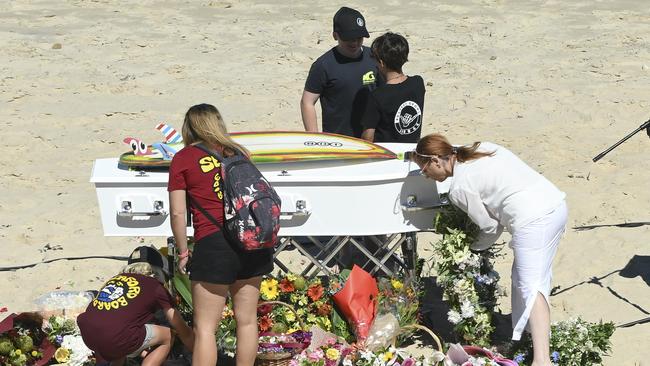 Flowers are laid at the coffin during the memorial for Khai Cowley at Seaford. Picture: NCA NewsWire / Mark Brake