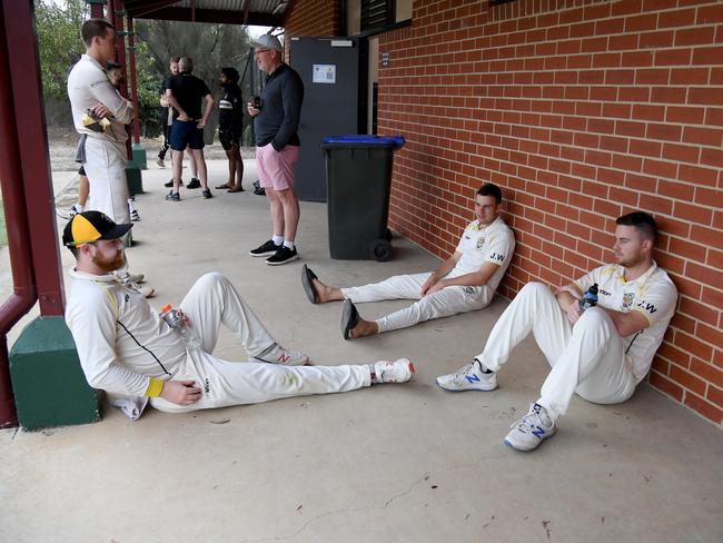 Players during a rain delay at the VTCA semi-final: Strathmore v Sunshine United cricket match in Strathmore, Saturday, March 13, 2021. Picture: Andy Brownbill