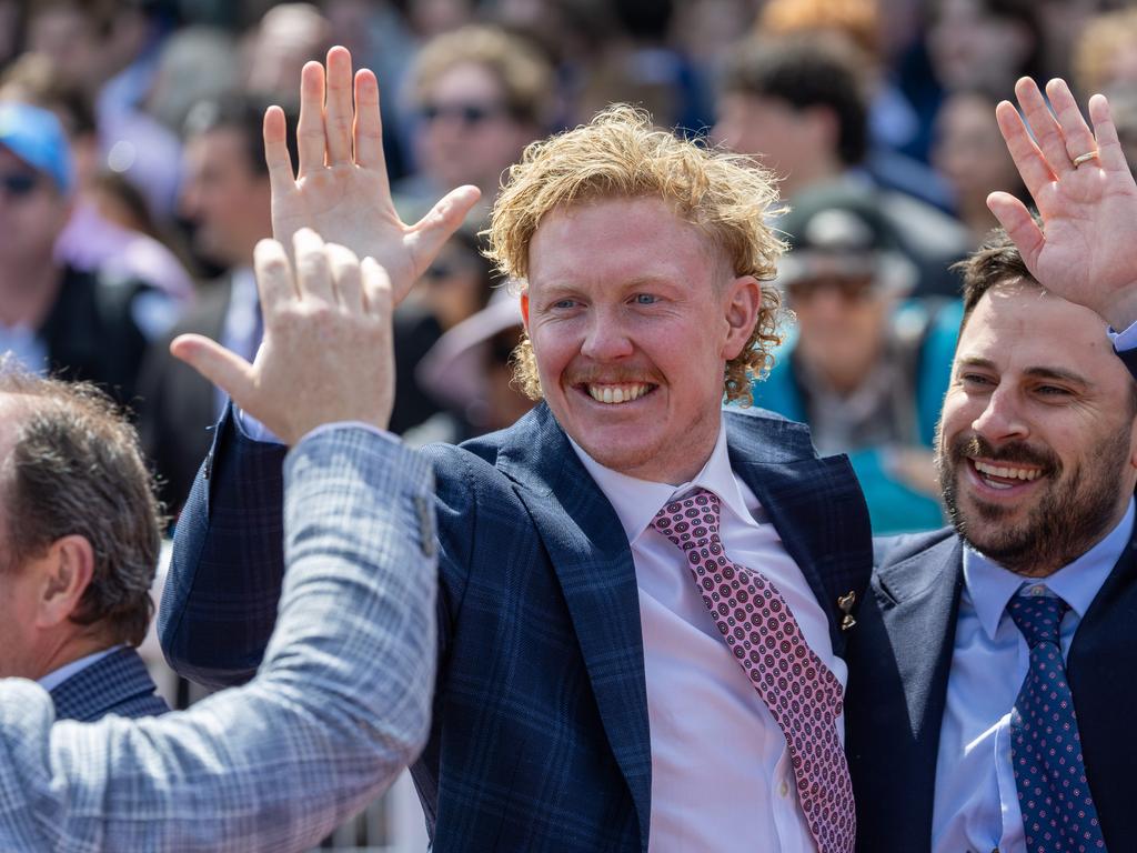 Clayton Oliver celebrates a win with mates on Caulfield Cup day Picture: Jason Edwards